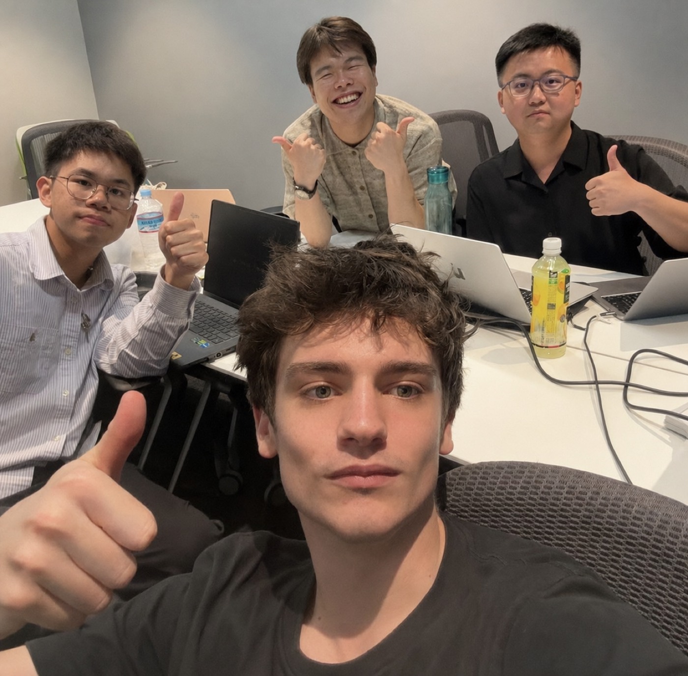 Yuxuan with his teammates and their mentor at the TIBC venue
